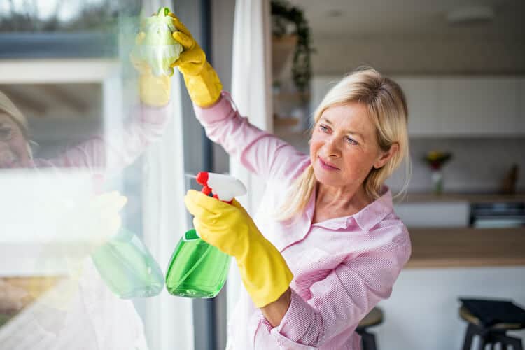 Senior woman spring cleaning.