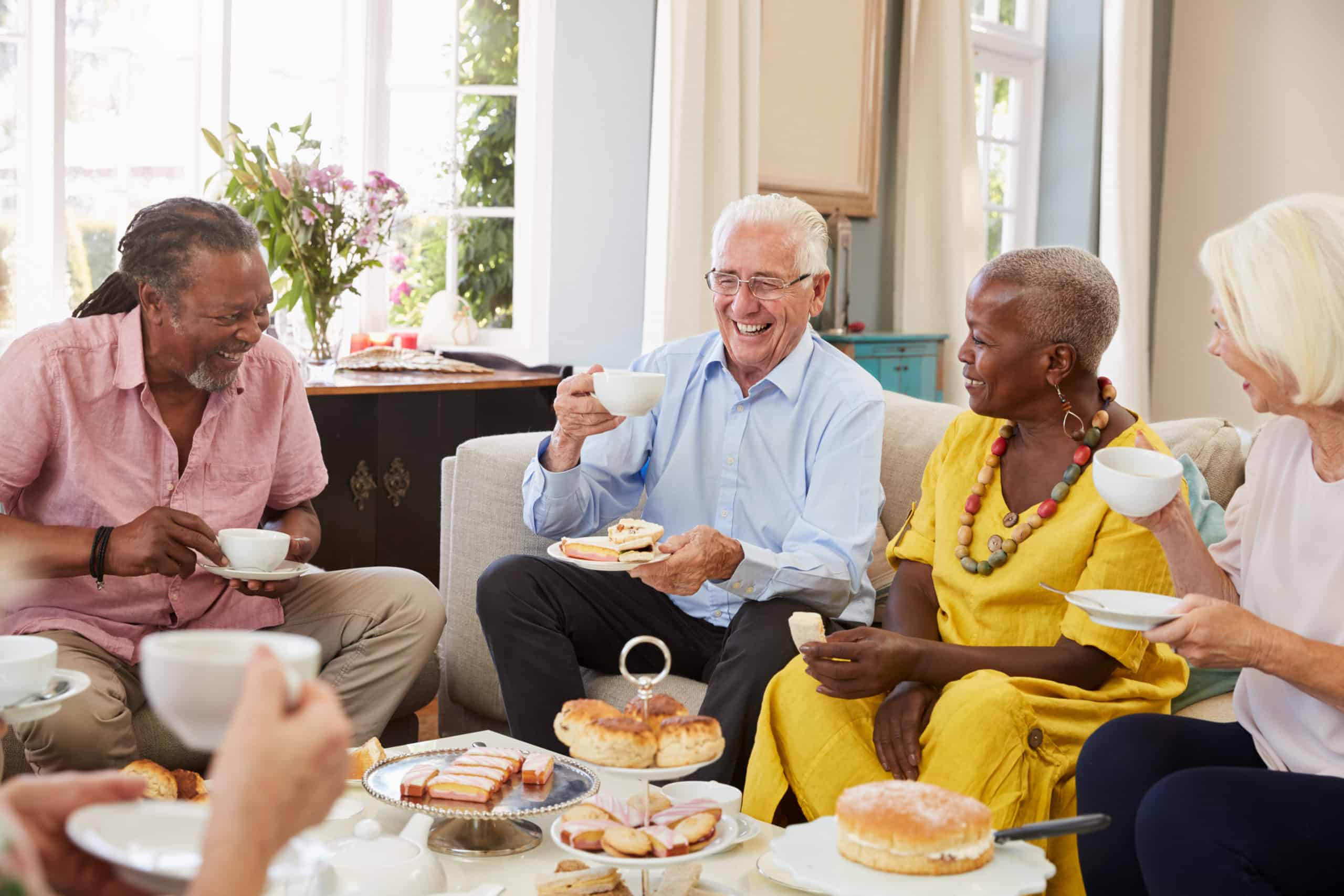 group of seniors enjoying a meal at a senior living community