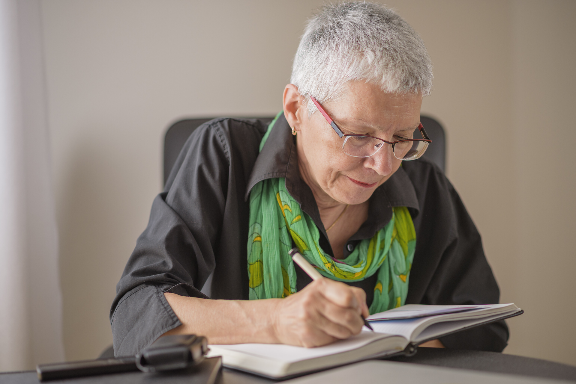 Senior woman writing in her journal