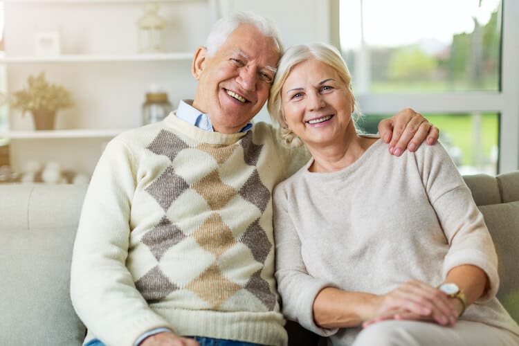 Happy senior couple enjoying their apartment in a CCRC.