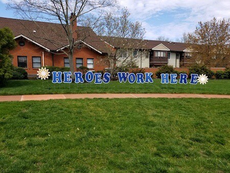 Monroe Village Heroes Work Here