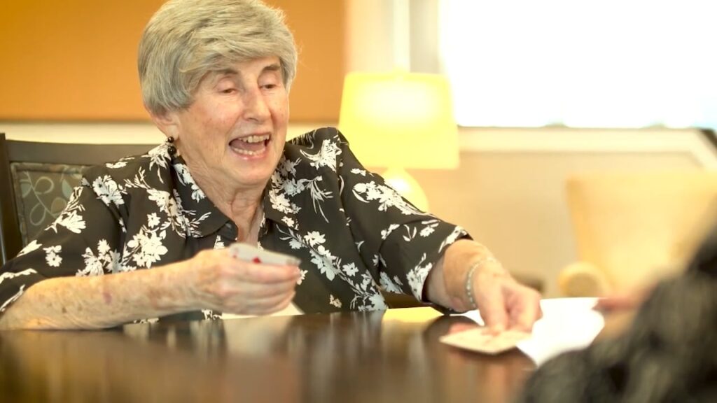 Senior woman playing cards