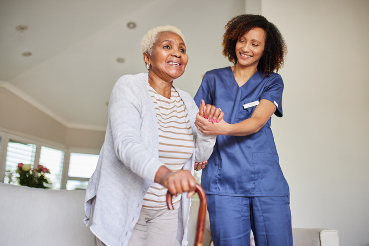 Senior being helped by caregiver