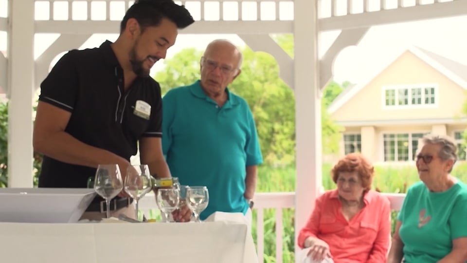 Seniors being served a drink