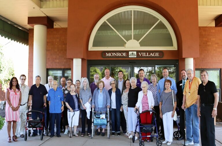 Senior group photo at entrance