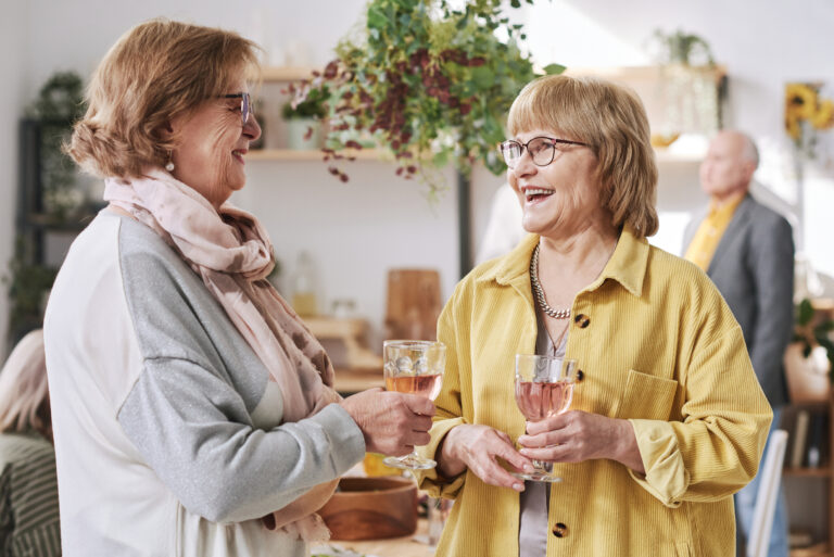 Senior friends sharing a drink