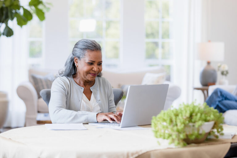 Senior planning on computer