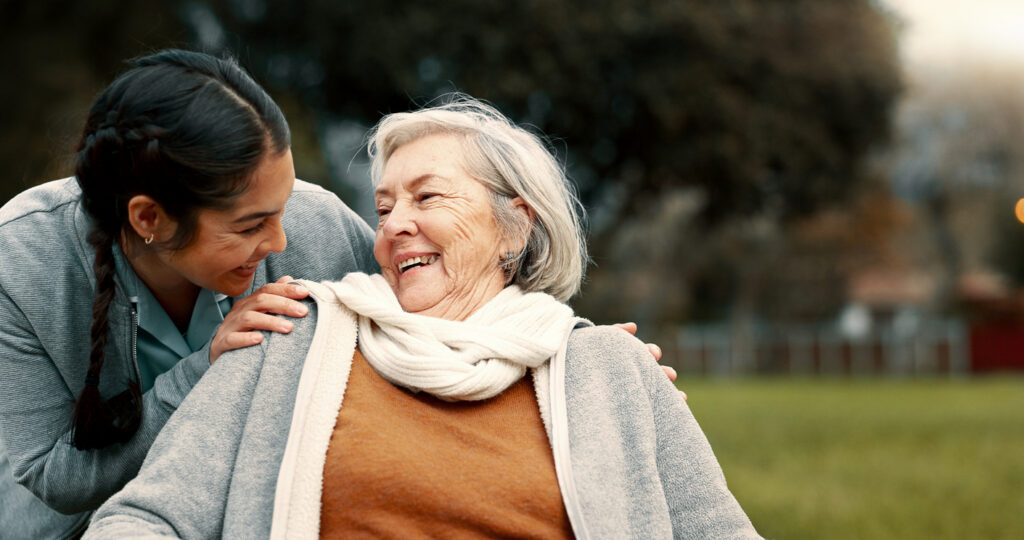 caregiver helping senior woman