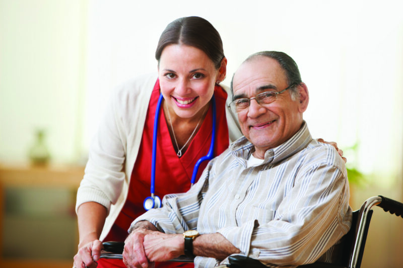 Senior with his friendly caregiver